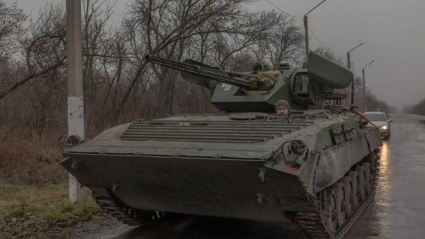 A Ukrainian soldier drives a military vehicle near Pokrovsk, Ukraine.