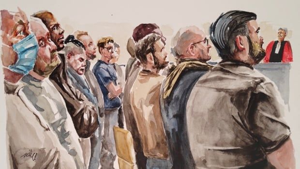 A courtroom sketch shows nearly a male defendants in courtroom.