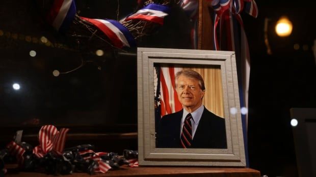 A framed photograph of Jimmy Carter.