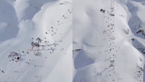 An overhead view of a ski mountain covered in snow with a broken ski lift. 