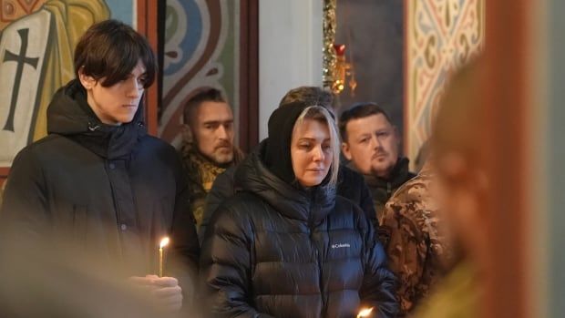 The family members of a Ukrainian solider killed in Donetsk in eastern Ukraine attend his funeral in Kyiv on Jan. 19. 