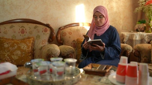 Bushra Al Taheel relaxes at home in Ramallah in the Occupied West Bank after being held in an Israeli prison for over 10 months.