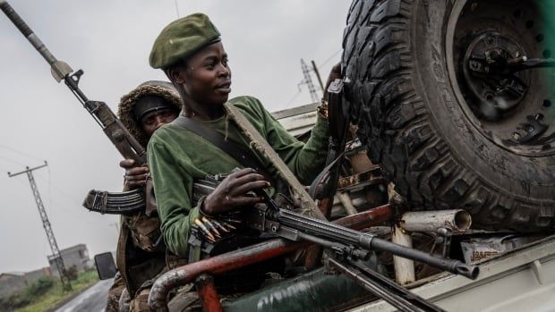 Military men in a jeep