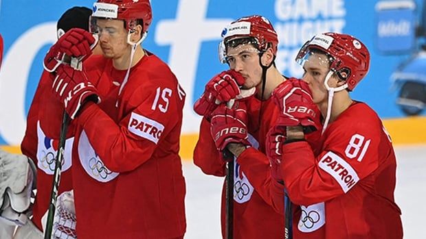 Men's hockey players are shown.