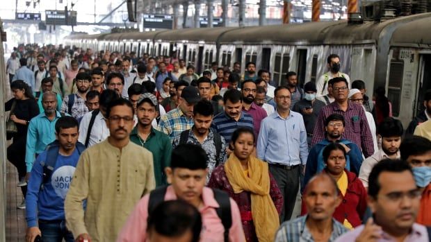 People disembark a train.