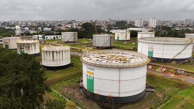 Petroleum tanks are shown at an oil terminal.