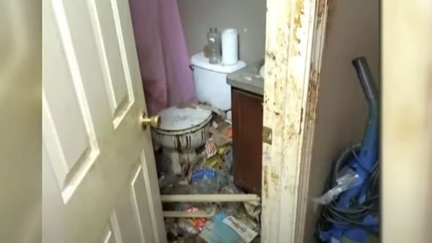 Part of a filthy washroom is shown. 