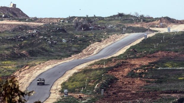 A military vehicle driving in the Gaza Strip.