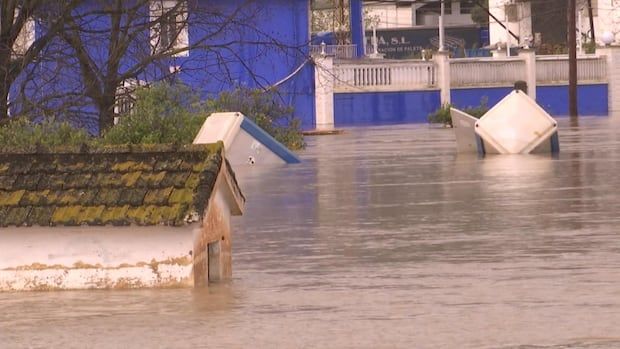 Buildings are submerged in water.