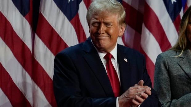 Republican presidential nominee former President Donald Trump claps at an election night watch party, Wednesday, Nov. 6, 2024, in West Palm Beach, Fla. (AP Photo/Julia Demaree Nikhinson)