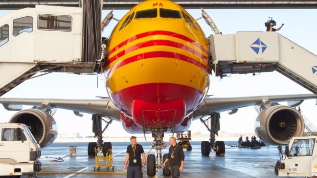 A airplane stands in the hangar at the European DHL Express air freight hub in Schkeuditz near Leipzig, Germany. This past summer, an incendiary device caused a fire at the cargo facility. A blaze officials are now linking to a wider, Russian-backed plot to target planes headed for Canada and the United States. 