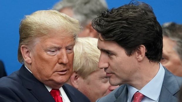 Trump looking down, Trudeau looking at him