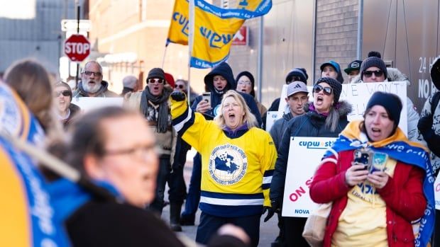 Members and supporters of the Canadian Union of Postal Workers (CUPW) rally outside a speaking engagement by Prime Minister Justin Trudeau in Halifax on Monday, December 9, 2024.