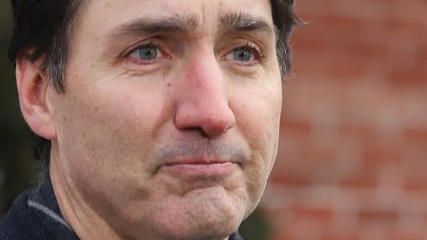 Looking emotional, Justin Trudeau speaks to reporters, announcing he intends to step down as Liberal Party leader and Prime Minister, but he will stay on in his post until a replacement has been chosen