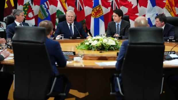 Ontario Premier Doug Ford (centre left) makes opening remarks during a first ministers meeting, with Prime Minister Justin Trudeau sitting next to him