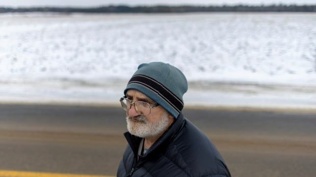 Stephen Phaneuf, who lives across the street from the border, poses for a photo near his home along the Canada-U.S. border between the U.S. state of New York and the Canadian province of Quebec, near Champlain, New York, U.S., January 17, 2025.