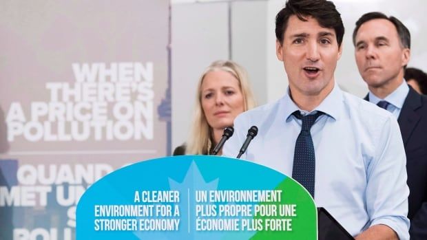 Liberal leader Justin Trudeau speaks to the media and students at Humber College regarding his government's new federally-imposed carbon tax in Toronto on October 23, 2018.