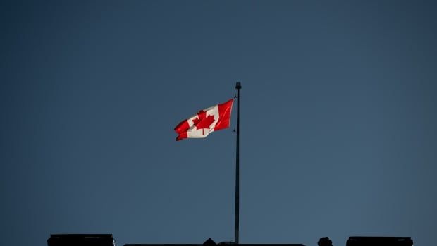 A Canadian flag flies over the Prime Minister's Office (PMO) near Parliament Hill in Ottawa, on Wednesday, Jan. 15, 2025.