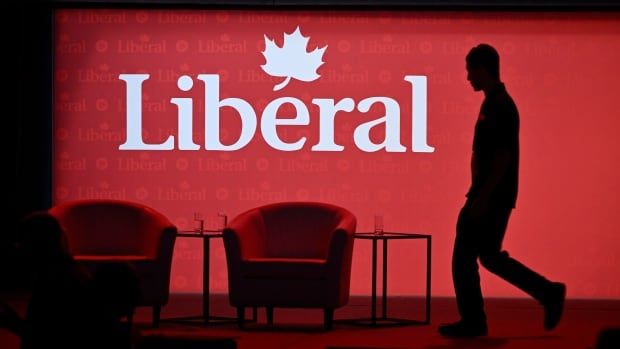 A stagehand works on the stage in between presenters at the 2023 Liberal National Convention in Ottawa, on Thursday, May 4, 2023.