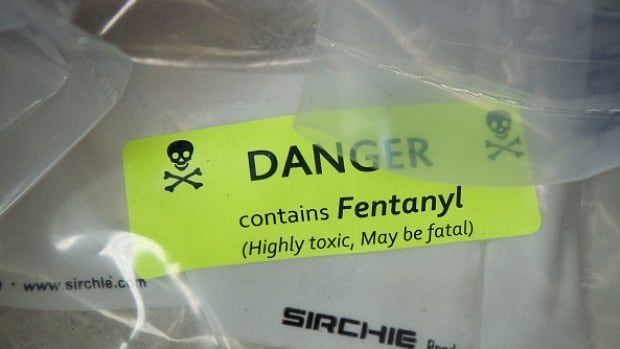 A plastic bag is shown with a green sticker with the label: Danger, contains fentanyl.