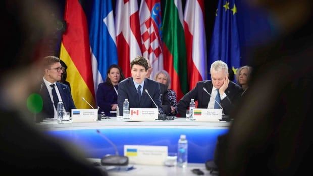 In this photo provided by the Ukrainian Presidential Press Office, Estonia's Prime Minister Kristen Michal, left, Prime Minister Justin Trudeau and Lithuanian President Gitanas Nauseda attend the Support Ukraine summit in Kyiv, Ukraine.