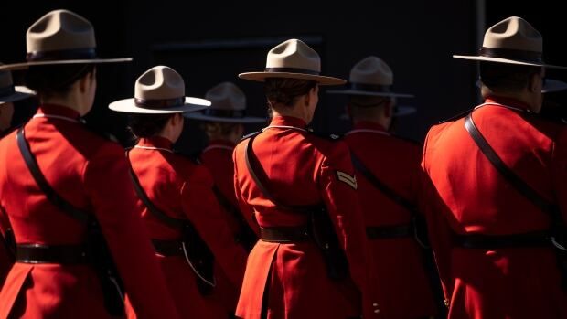 RCMP members are pictured wearing their red serge uniforms during a Change of Command ceremony in Langley, British Columbia on Tuesday, September 20, 2022. 