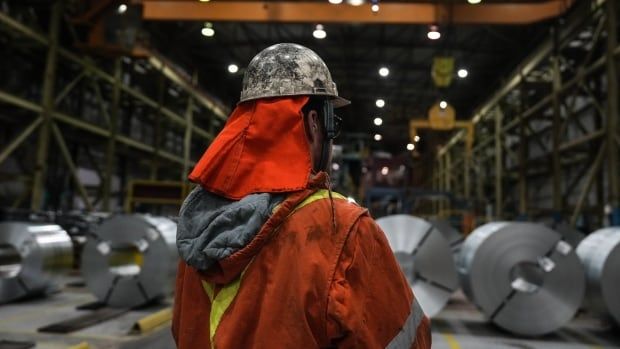 A steelworker is seen at the ArcelorMittal Dofasco Steel Plant in Hamilton, on Friday, February 14, 2025.