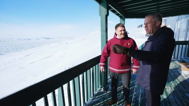 Prime Minister Mark Carney, right, meets with Nunavut Premier P.J. Akeeagok at the Nunavut Commissioner's official residence in Iqaluit, Nunavut, on Tuesday, March 18, 2025.