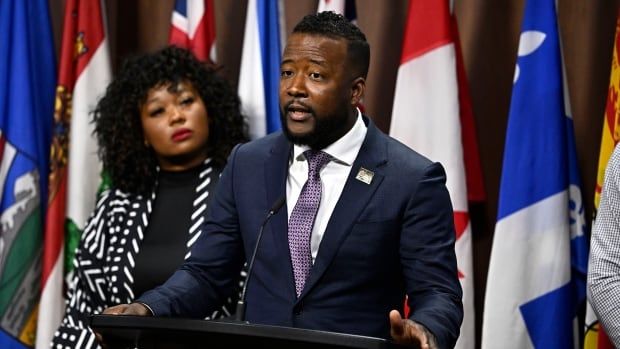 Nicholas Marcus Thompson, right, executive director of the Black Class Action Secretariat, and Bernadeth Betchi, CHRC employee and representative plaintiﬀ, participate in a news conference on the Global Alliance of National Human Rights Institutions' “Special Review” of the accreditation of the Canadian Human Rights Commission, on Parliament Hill, in Ottawa, Monday, June 10, 2024.