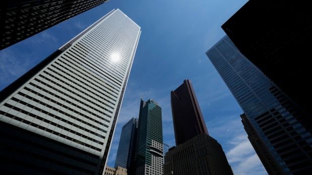 Several skyscrapers are shown from the angle of someone tilting the camera up from the ground to take a photo. 