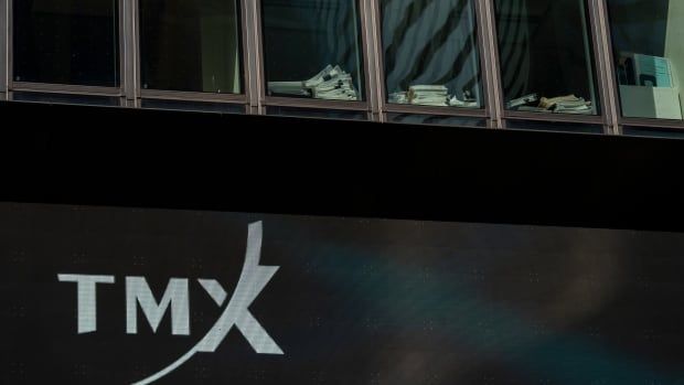 The acronym TMX is pictured on the side of a building.