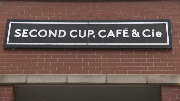 A sign of Second Cup from outside. 