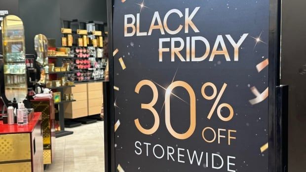 A sign placed outside a store reads 'Black Friday 30 per cent off storewide'