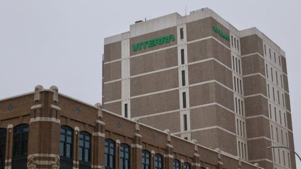 A multi-storey building emerges from the clouds. On the building's side in green letters is the word "Viterra"