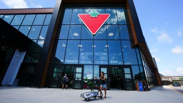 A Canadian Tire store in a city on a summer day.