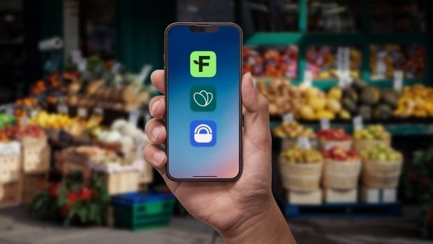 Phone with three apps held in front of a fruit display outside a grocery store