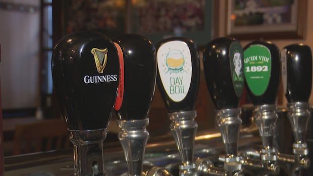 Several branded beer taps can be seen, with the focus on one reading 'Guinness'