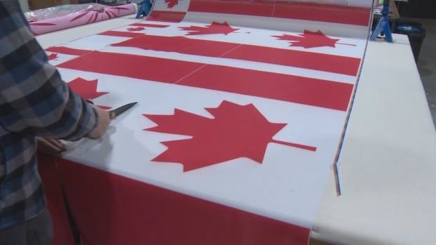 The production of Canadian flags at a facility in Port Coquitlam, B.C.