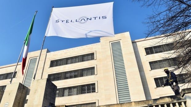 The logo of Stellantis, the world's fourth-largest automaker which starts trading in Milan and Paris after Fiat Chrysler and Peugeot maker PSA finalised their merger, is seen on a flag at the main entrance of FCA Mirafiori plant in Turin, Italy, January 18, 2021. REUTERS/Massimo Pinca