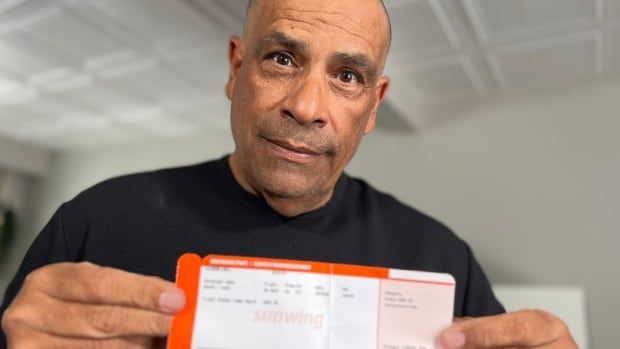 Hans Roach holds the receipt for the $50 flight change fee Sunwing charged him.