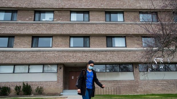 A healthcare worker leaves after finishing her shift for the day at the Eatonville Care Centre in Toronto on Friday, April 24, 2020.