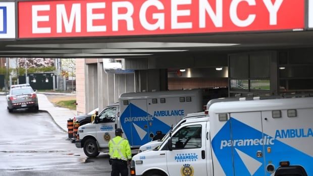 Ambulances sit at the emergency room entrance at the Michael Garron Hospital.