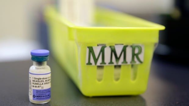 A measles, mumps and rubella vaccine is shown on a countertop