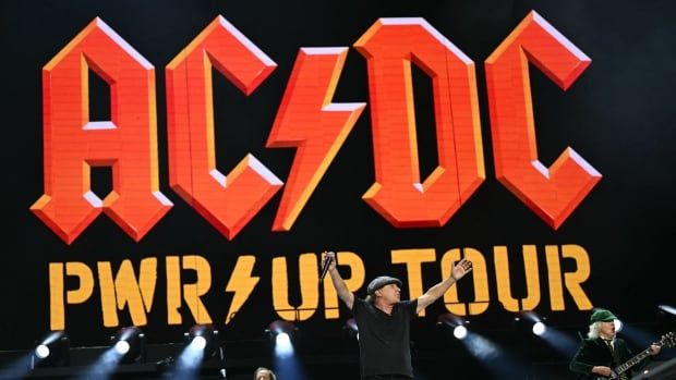 Rock band AC/DC is pictured on stage. 