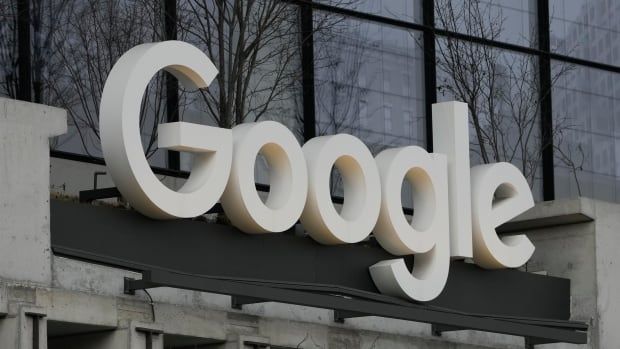 A white Google logo is displayed on the front of a building.