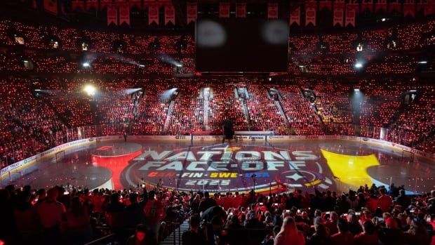 A full hockey stadium with many fans dressed in red during a Canada-Sweden match up at the 4 Nations Face-Off.