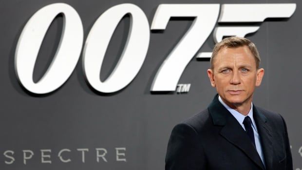 Daniel Craig poses for the media as he arrives for the German premiere of the James Bond movie 'Spectre' in Berlin, Germany.  