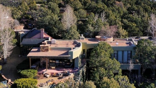 A large house surrounded by trees.