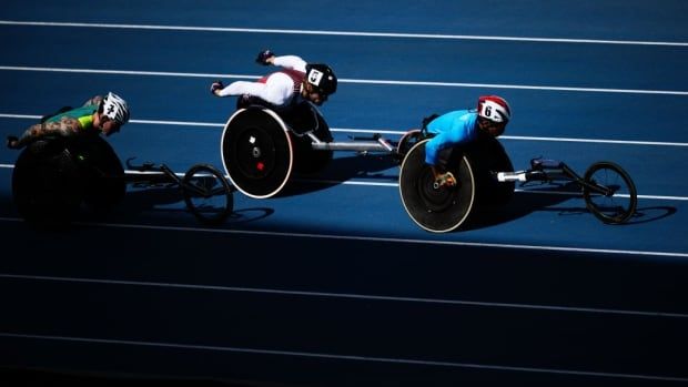 Wheelchair racers compete.