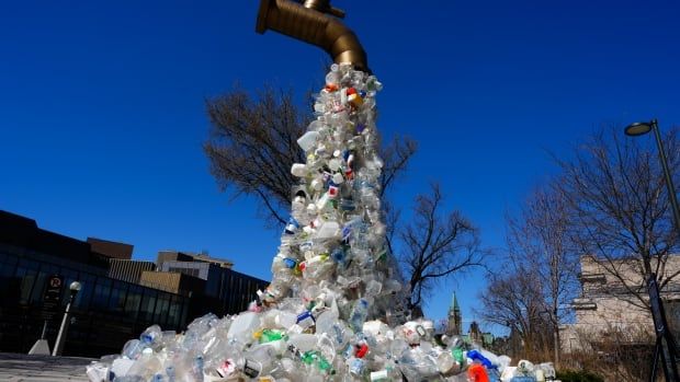 giant plastic tap art installation